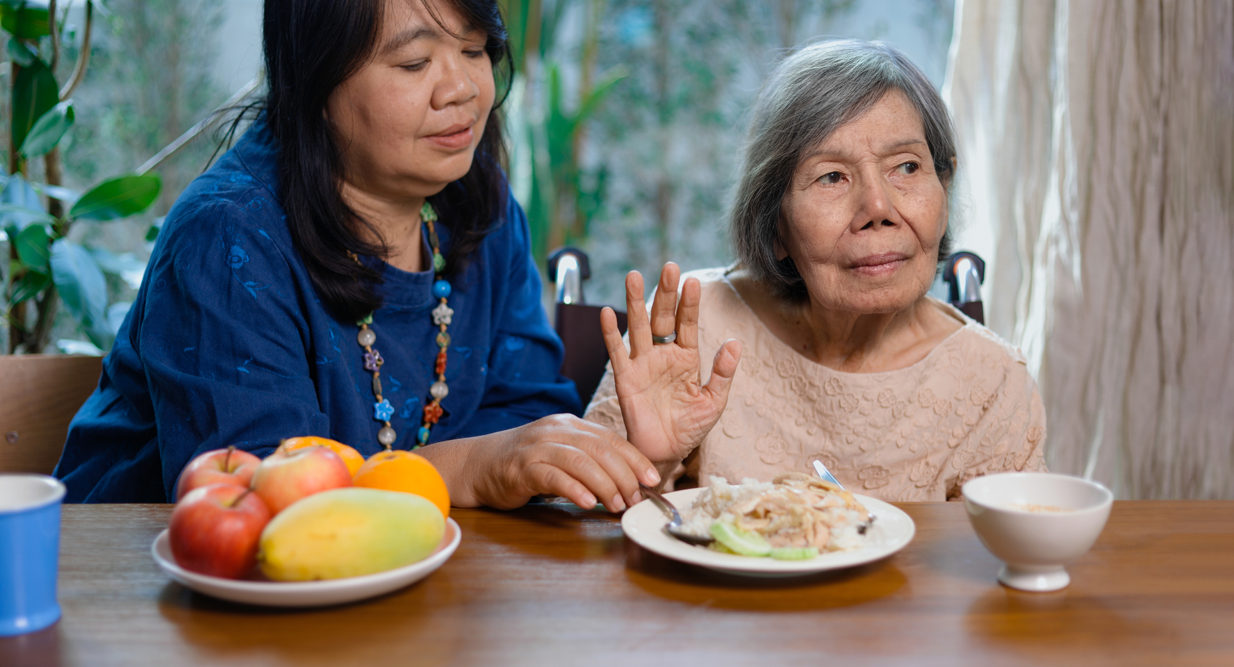 Senior,asian,woman,bored,with,food.