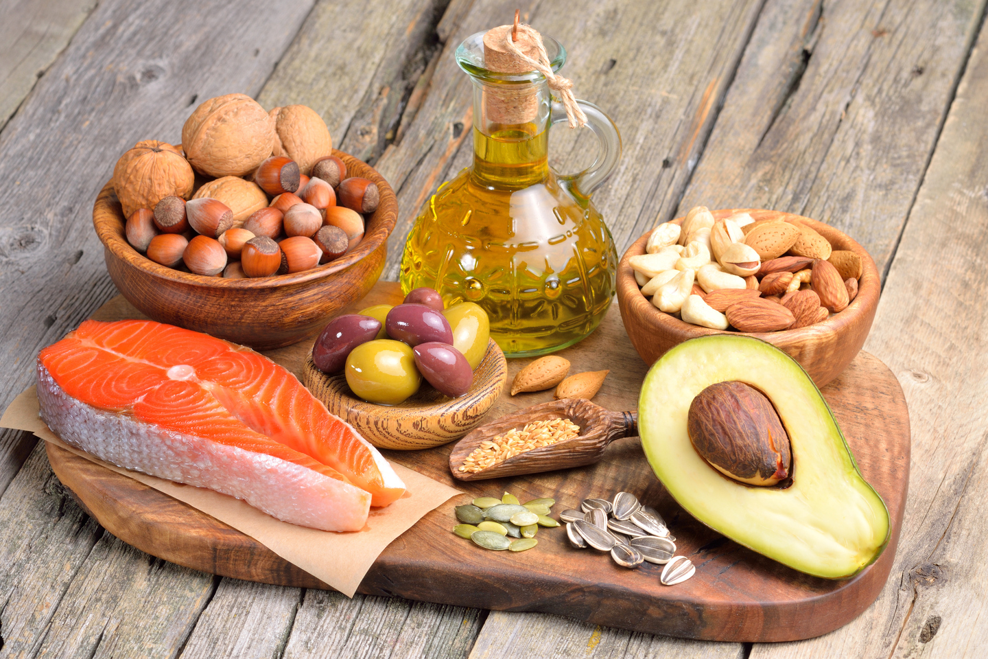 Selection,of,healthy,fat,sources,on,wooden,background.